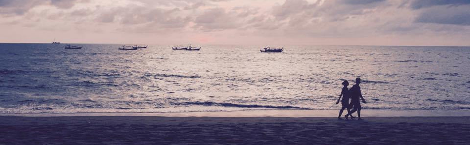 People walking along the beach